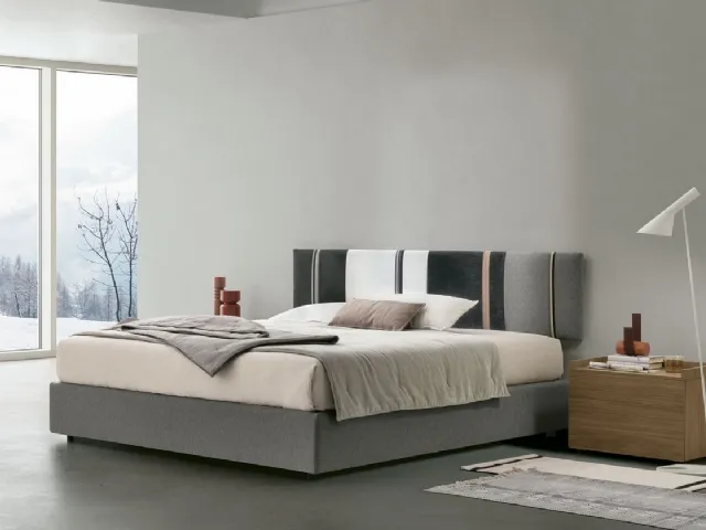 Diagonal sommier bed with storage box and headboard panel by Tomasella