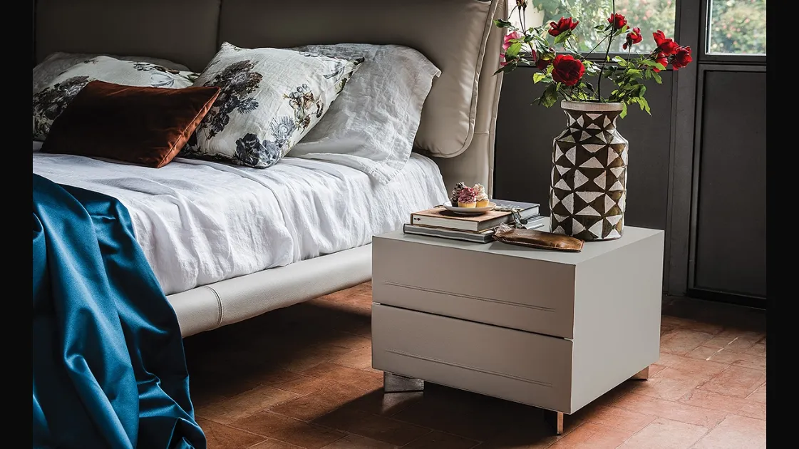 Cattelan Italia's Dyno bedside table in wood covered with leather.