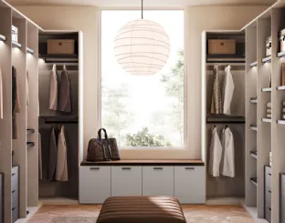 Open walk-in closet in matte lacquer and metal by Orme.